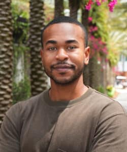 Portrait of a Dane Shelton posing outdoors at the USF campus